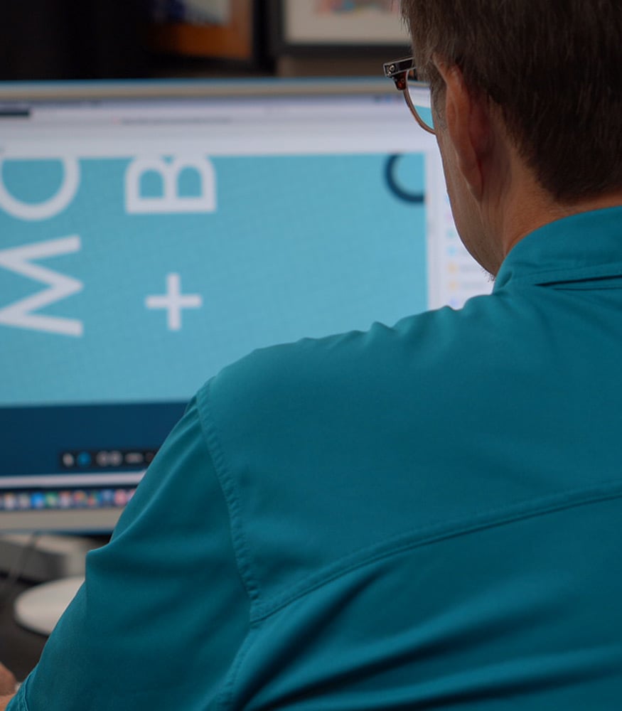 Man looking at a varispark storefront for print collateral and direct mail