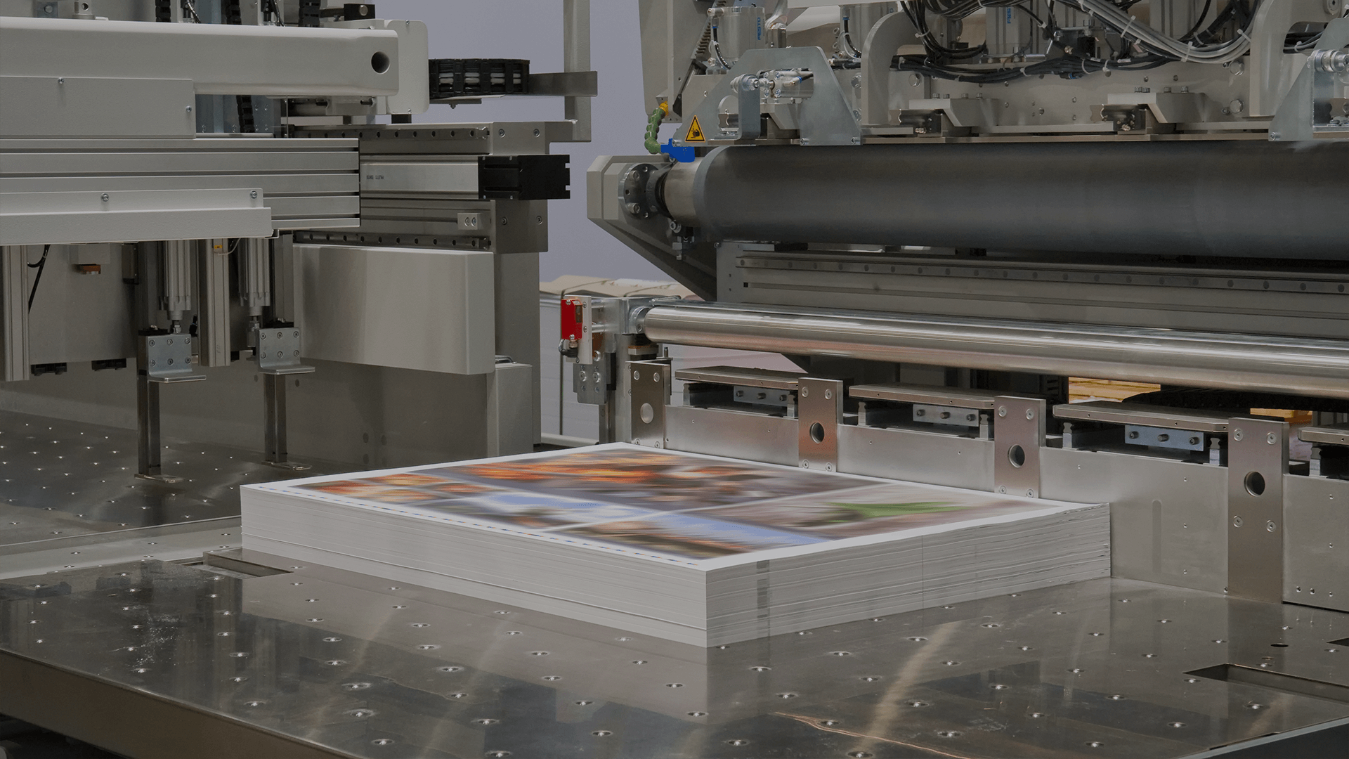 A stack of postcards on a press
