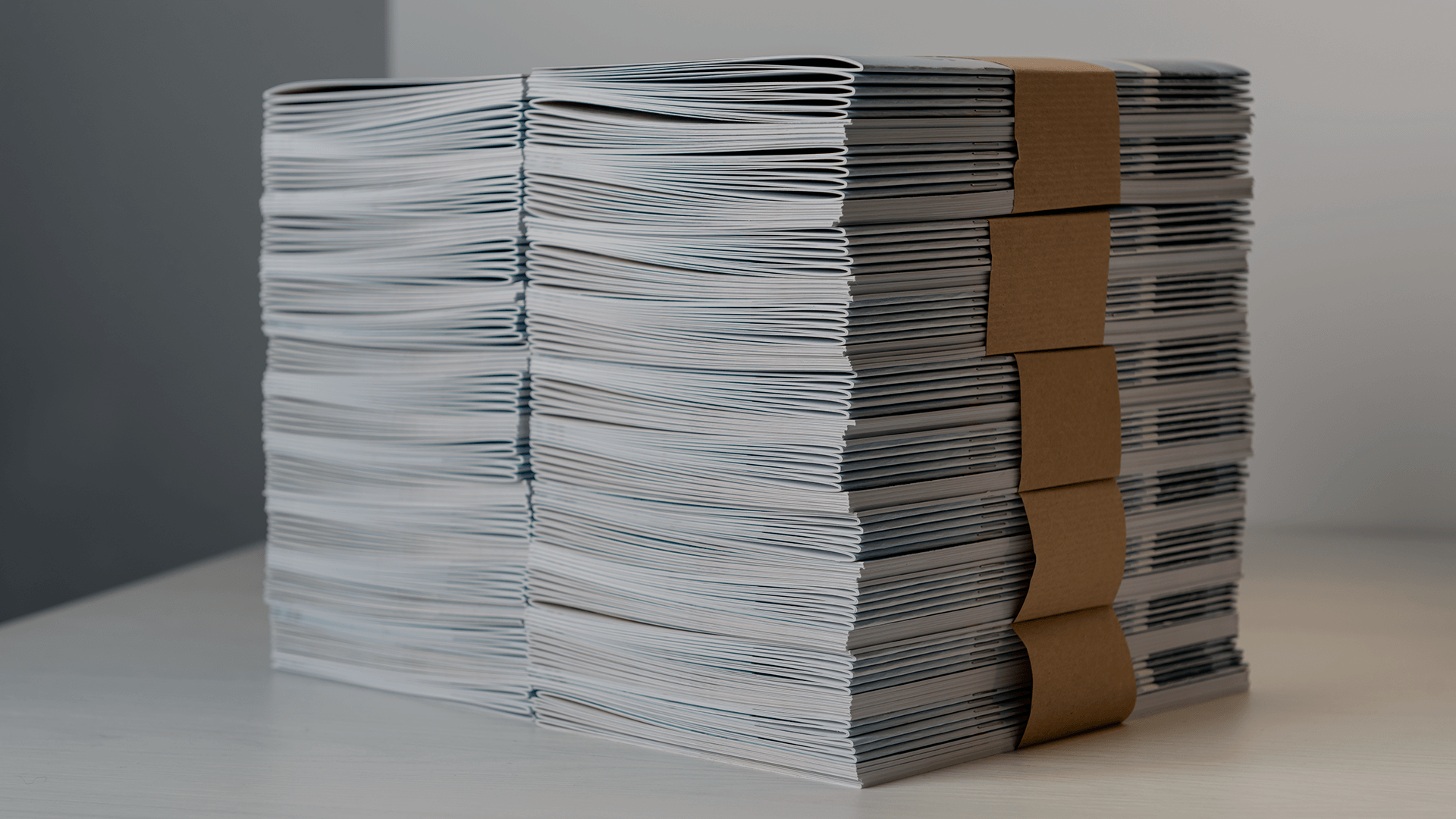 A stack of printed direct mail pieces