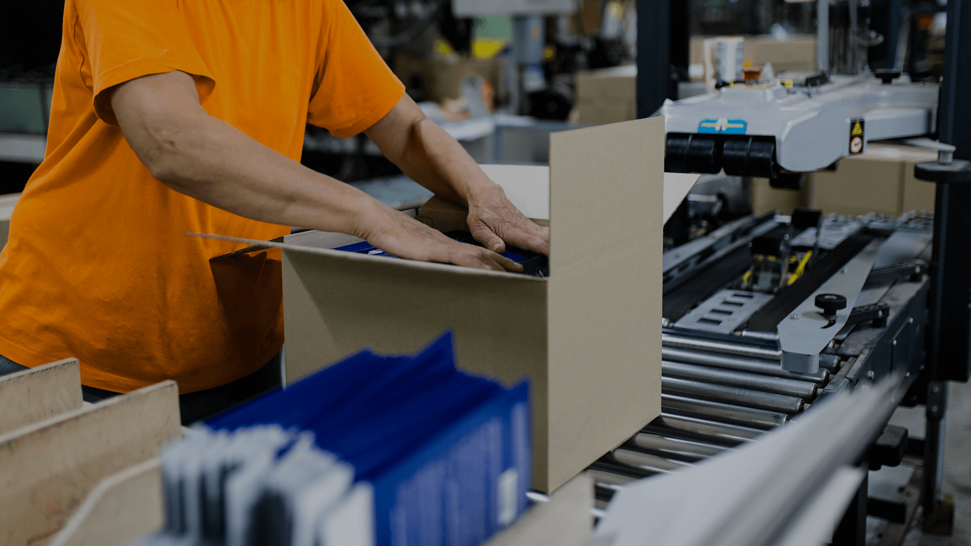 A worker packing print materials