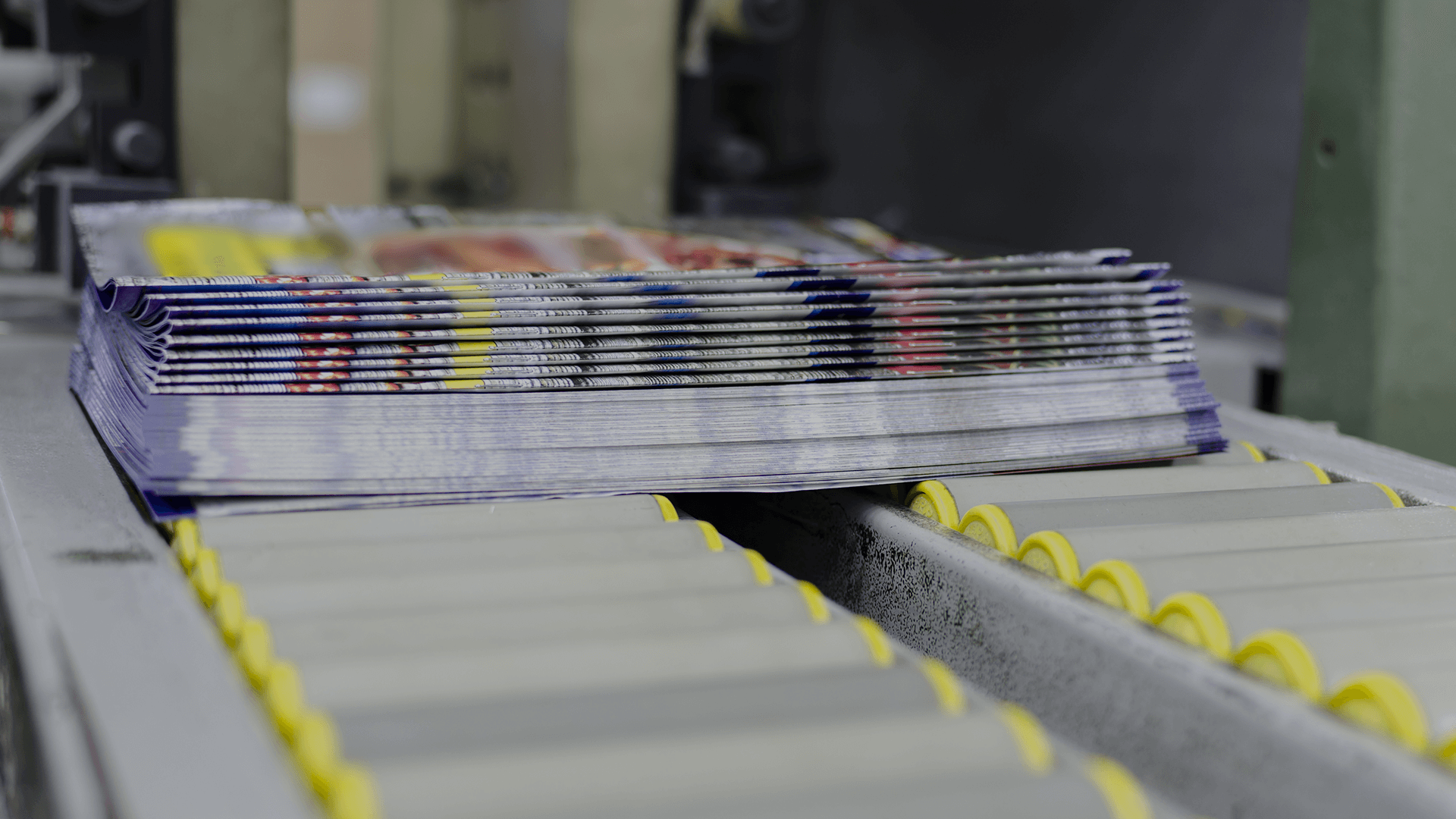 magazines on conveyor belt