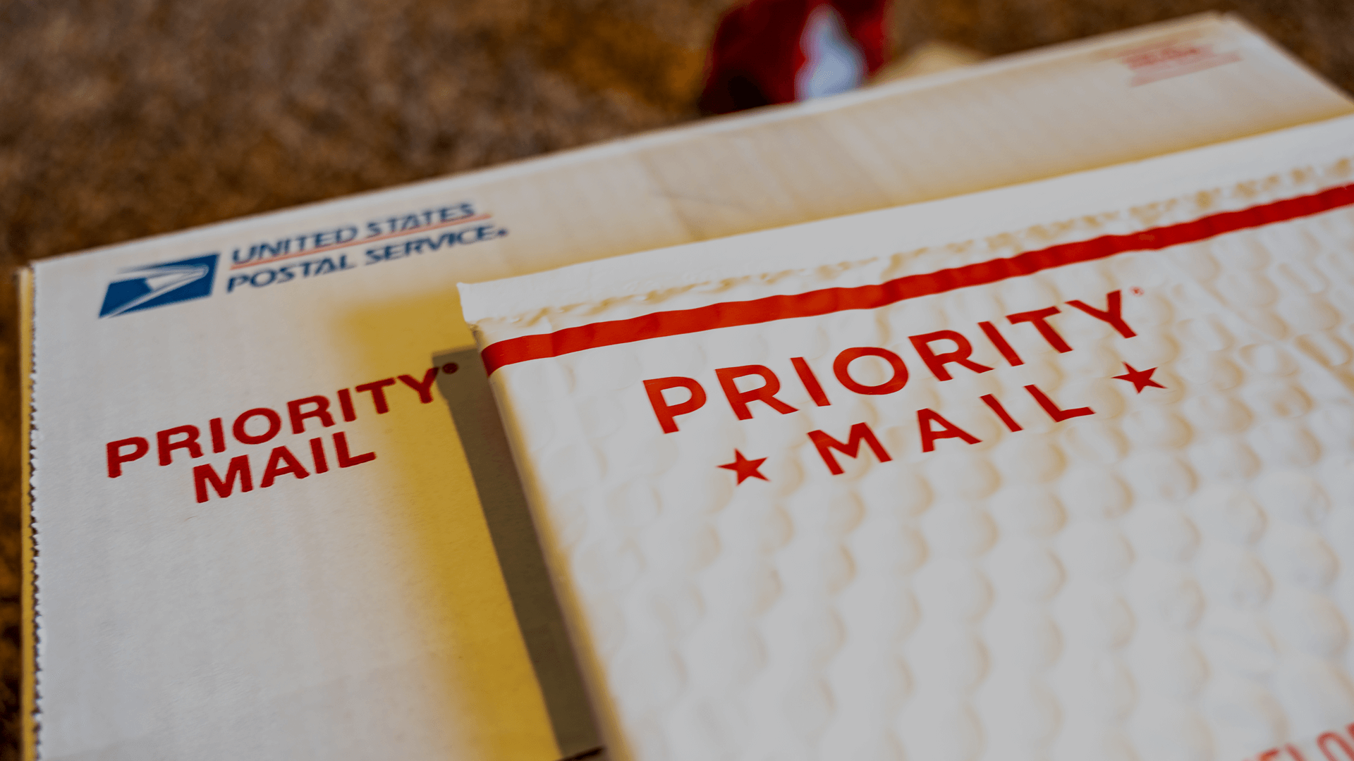 A USPS priority mail box and envelope